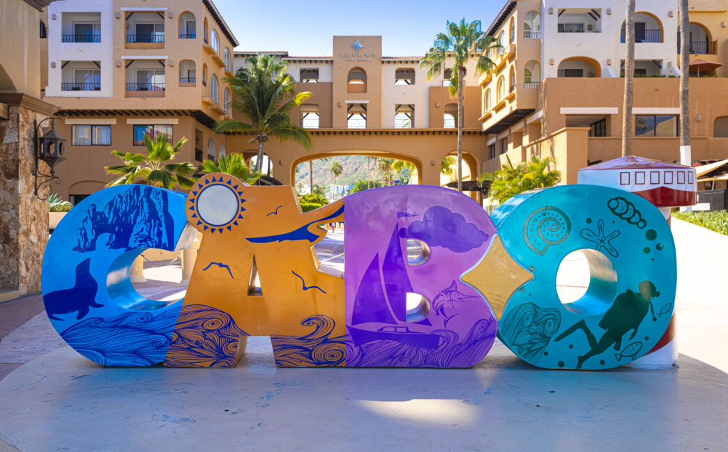 Los Cabos colorful letters in Cabo San Lucas marina a departure point for cruises, marlin fishing and lancha boats to El Arco Arch and beaches - Gringo Gazette