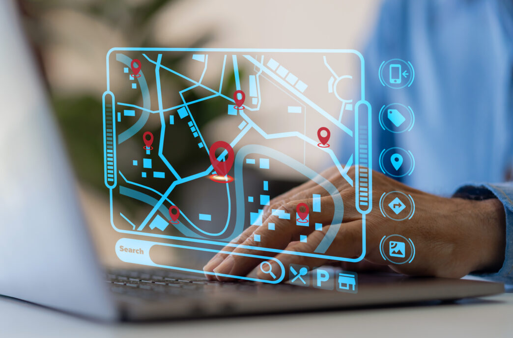 Technology smart navigation and location tracking with professional hand interacting with futuristic GPS map interface locations of services, delivery, travel app, logistics and transportation - Gringo Gazette