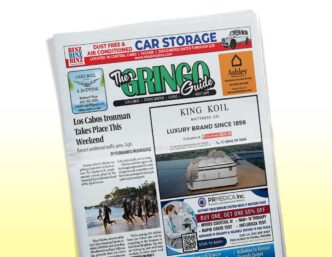 Front page of The Gringo Guide newspaper, featuring articles and multiple ads including a King Koil ad, tilted on the page reading area