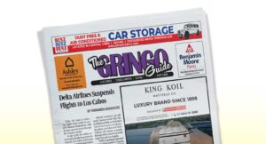 Tilted newspaper front page showing 'The Gringo Guide' masthead with ads and a Delta Airlines article headline reading 'Delta Airlines Suspends Flights to Los Cabos'