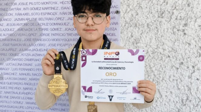 Person holding a certificate that says "RECONOCIMIENTO ORO" with two medals hanging from their necks against a textured wall background, facing camera.