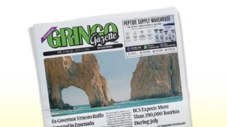 3125 - Gringo Gazette Front page of a newspaper titled Gringo Gazette, featuring a coastal rock arch photo.