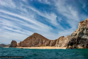 Navy Rescues Two Americans Trapped by Surf at Divorce Beach