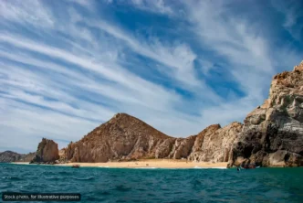 Navy Rescues Two Americans Trapped by Surf at Divorce Beach