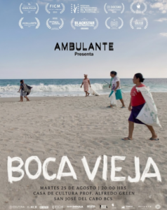 ambulante Film poster for Boca Vieja, presented by Ambulante, showing four people walking on a sunny beach with the ocean in the background; numerous festival logos line the top and screening details appear at the bottom.